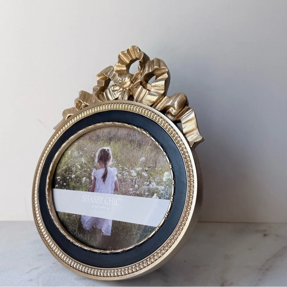 Ornate Oval Gold Photo Frame with Black Trim bow on top 7”x5”